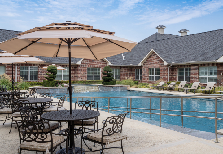 Sunny Outdoor Pool and Lounge at Independent Living Facility Sunny Outdoor Pool and Lounge at Independent Living Facility
