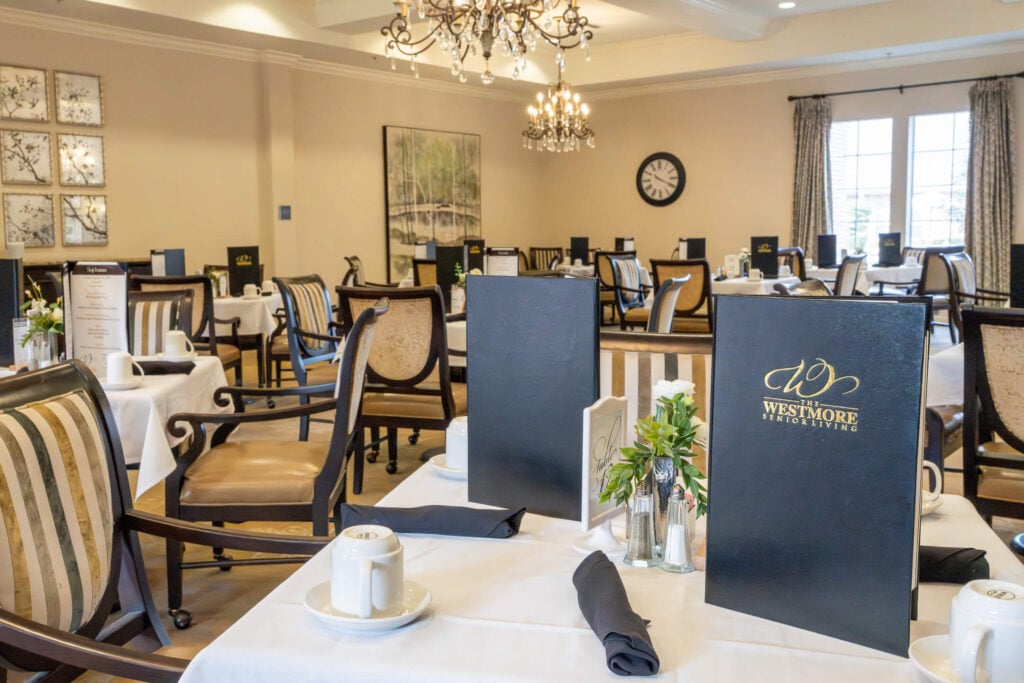 Elegant Chandelier-Lit Dining Room at Assisted Living Facility