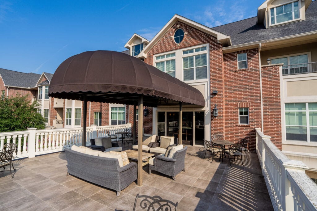 Covered Outdoor Patio Seating at Independent Living Facility